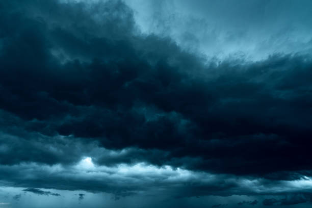 istock Dark dramatic sky and clouds. Background for death and sad concept. Gray sky and fluffy white clouds. Thunder and storm sky. Sad and moody sky. Nature background. Dead abstract background. Cloudscape. 1270949850
