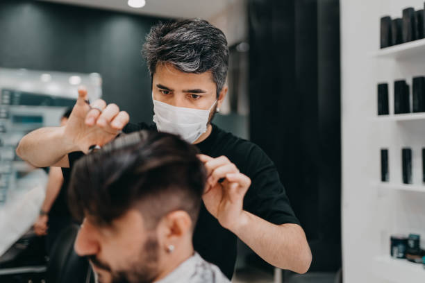 Barber Cutting His Customers Hair During New Normal Stock Photo - Download  Image Now - iStock