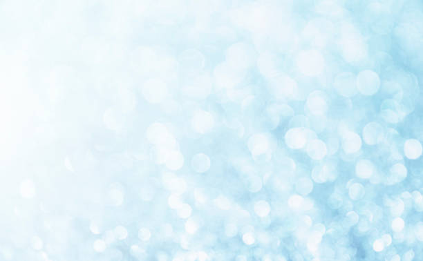 istock Blue background. White glitter blur vintage lights background. Bokeh silver and white. de-focused copy space. 1270953117