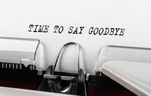 Text Time to Say Goodbye typed on typewriter