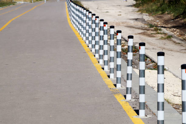 istock fence posts on the pedestrian sidewalk close up 1270958348