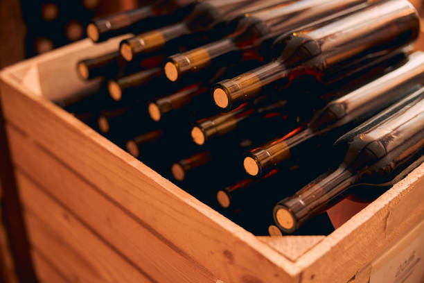 istock Bottles of wine with corks in wooden crate 1270961673