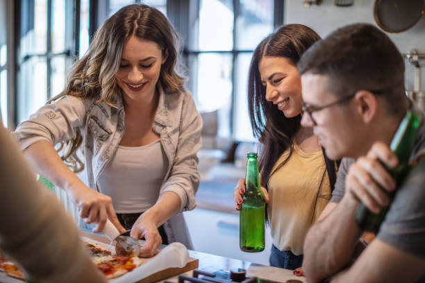 istock Best friends preparing pizza at home 1270962215
