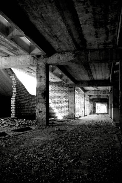 istock Unfinished and abandoned concrete and brick building. Unfinished construction with harsh sun light and shades. 1270962763