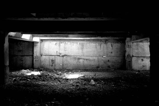 istock Unfinished and abandoned concrete and brick building. Unfinished construction with harsh sun light and shades. 1270962777