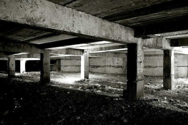 istock Unfinished and abandoned concrete and brick building. Unfinished construction with harsh sun light and shades. 1270962779