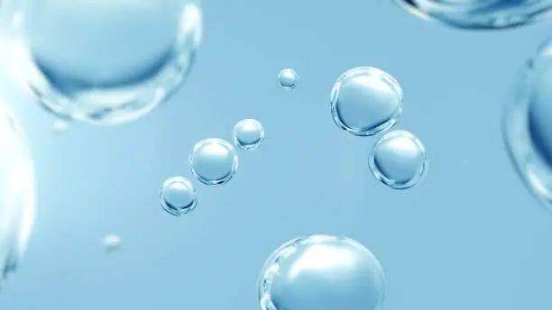 Effervescent fizz and clean cosmetics hygiene or rejuvenate renewable energy. Studio shot of transparent cosmetic blue gas bubbles under water in full-frame macro close up with selective focus blur.