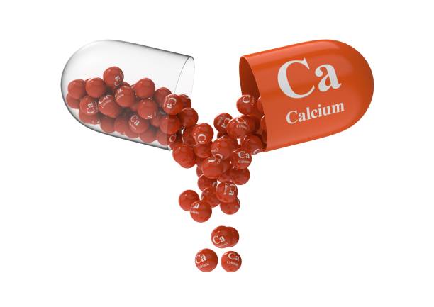 istock Open capsule with calcium from which the vitamin composition is pouring 1270968847