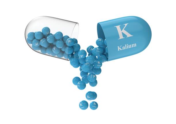 istock Open capsule with kalium from which the vitamin composition is pouring 1270968854