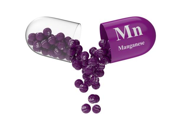 istock Open capsule with manganese from which the vitamin composition is pouring 1270968862