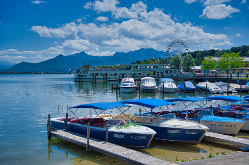 Prien, Bavaria, Germany - July 07, 2020: Ferry harbor with rental boats in Prien, a touristic village at the Chiemsee, Germany