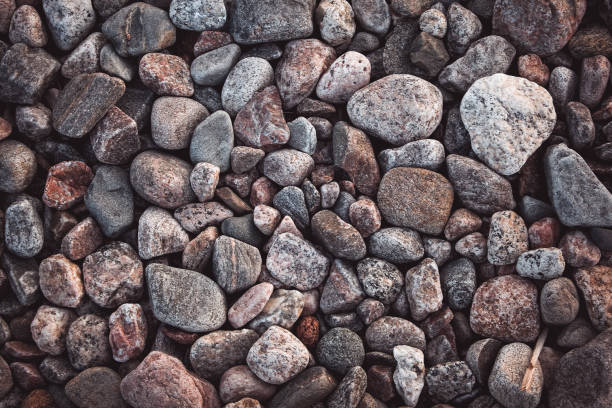 istock Texture with multicolored stones on rocky beach 1270970404
