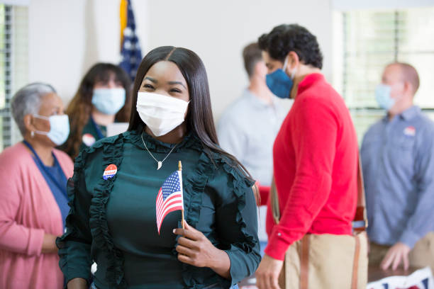 African descent lady waiting to vote.