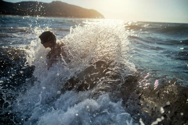 istock Little boy having fun in the Tuscan sea 1270974126