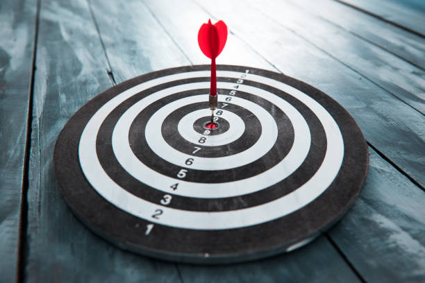 istock Red dart arrow hitting in the target center 1270974153