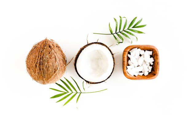 istock Pattern with coconuts and tropical palm leaves on white background. Tropical abstract background. Flat lay, top view 1270978845