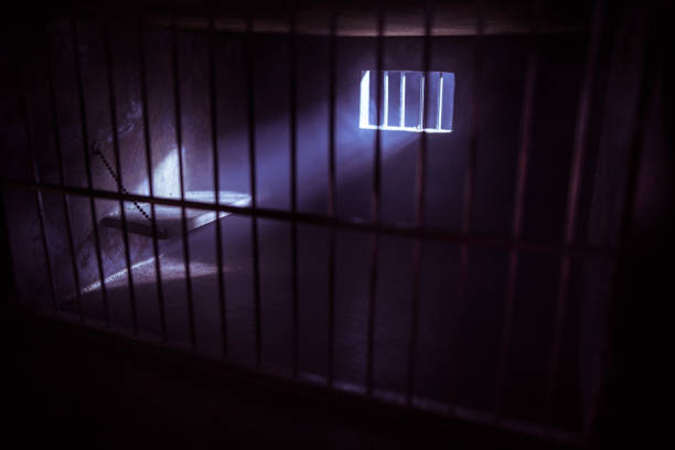 istock Jail or prison cell. Old grunge prison miniature. Dark prison interior creative decoration. Empty cell. Selective focus Obsolete gray grunge concrete room. 1270980109