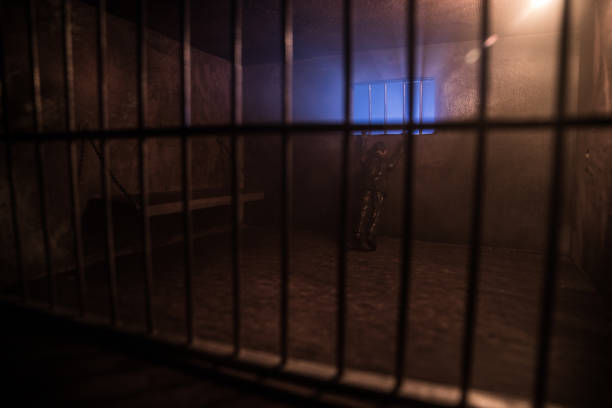 istock Jail or prison cell. Old grunge prison miniature. Dark prison interior creative decoration. Empty cell. Selective focus Obsolete gray grunge concrete room. 1270980110