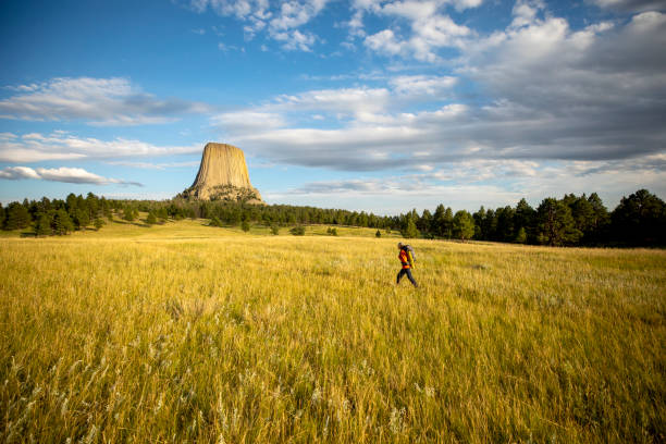 Young men backpacking at Devils Tower Park in Wyoming, USA