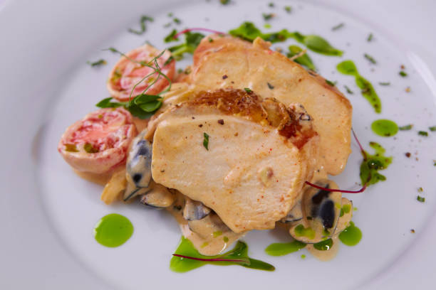 istock Sliced peanut crusted chicken breast with fresh salad and sauce 1270982563