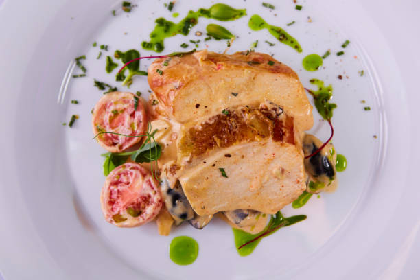 istock Sliced peanut crusted chicken breast with fresh salad and sauce 1270982585