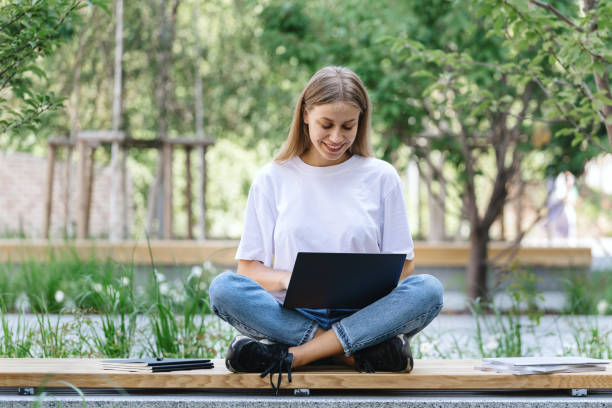 istock Young university student girl using modern laptop 1270984075