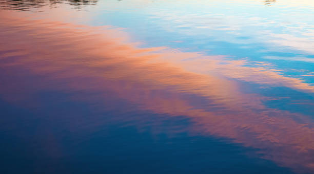 istock Sunrise-Cloud colors reflected on lake surface-Indiana 1270984418