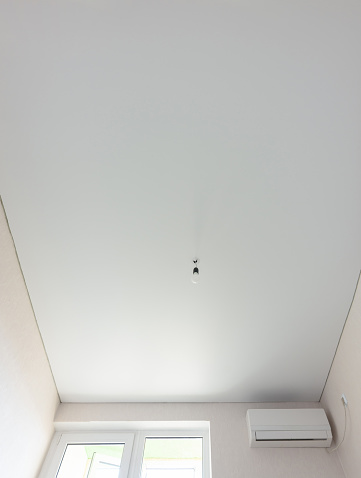 Matte vinyl stretch ceiling in the interior of the room