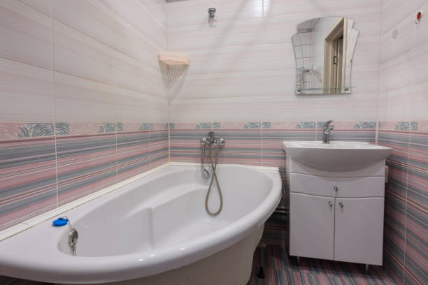 The interior of an ordinary habitable bathroom in the interior of a hotel room stock photo