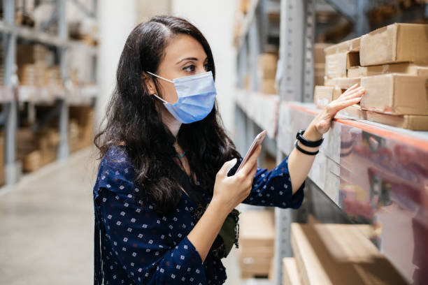istock Customer with sterile mask using mobile phone application and checking product 1270986950
