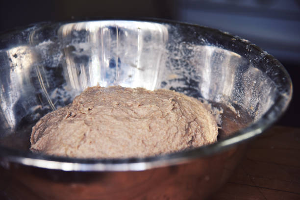 a close up of a stainless steel bowl - dough sphere kneading bread imagens e fotografias de stock