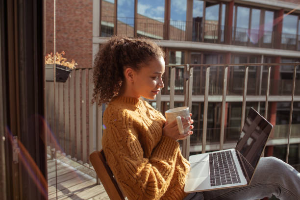 istock Young woman is drinking coffee on the balcony 1270989668