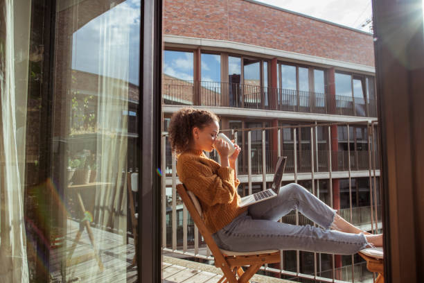 istock Young woman is drinking coffee on the balcony 1270989669