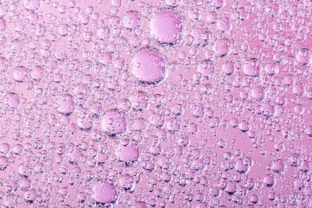 istock oil with bubbles on coral background. Pink Abstract space background. Soft selective focus. macro of oil drops on water surface. copy space. air bubbles in water 1270990720
