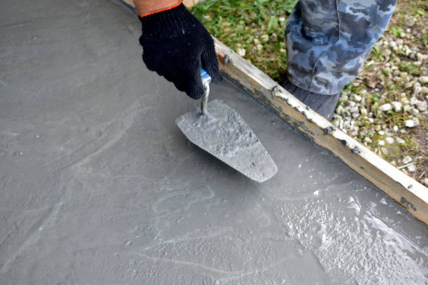 istock Working on concrete with a trowel leveling the surface 1270992266