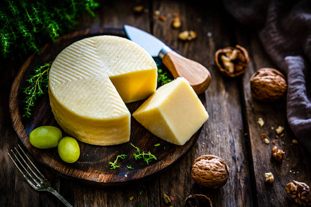 istock Goat cheese on rustic wooden table. High angle view 1270993727