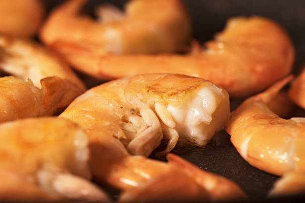 istock Closeup view of King prawns are fried in a pan. 1270993929