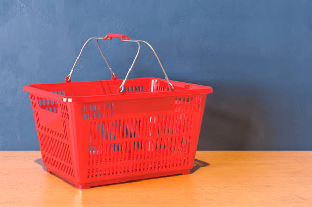istock Red shopping basket on the wooden table. 3D rendering 1270997460