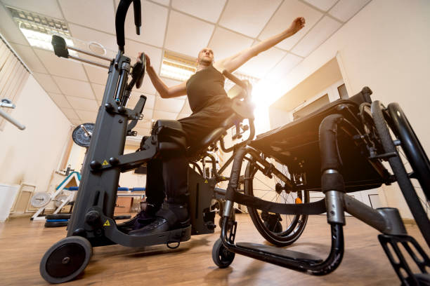 istock Disabled man training in the gym. Rehabilitation center 1271000719