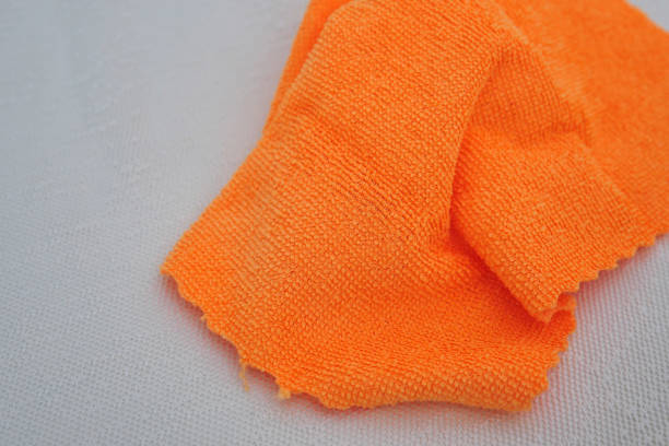 istock Cleaning the camera lens and filter glasses with microfiber cloth, lens and filter glass maintenance, 1271001554