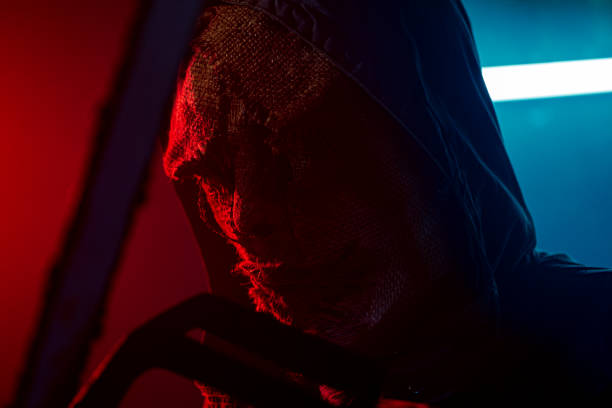 istock Man in disguise wearing a scary mask for Halloween 1271002830