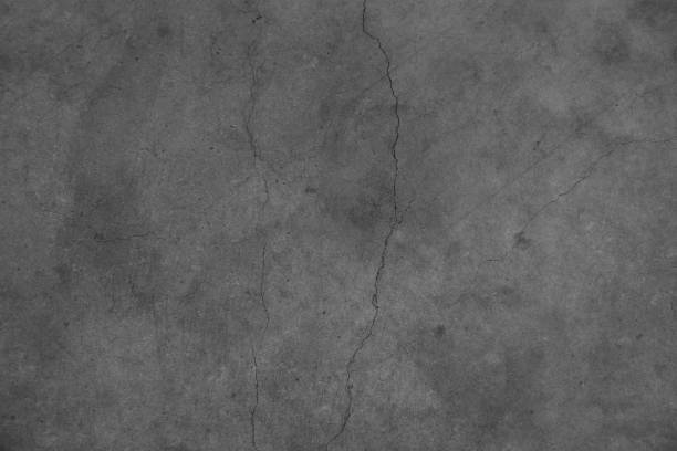 Grey cracked concrete stock photo
