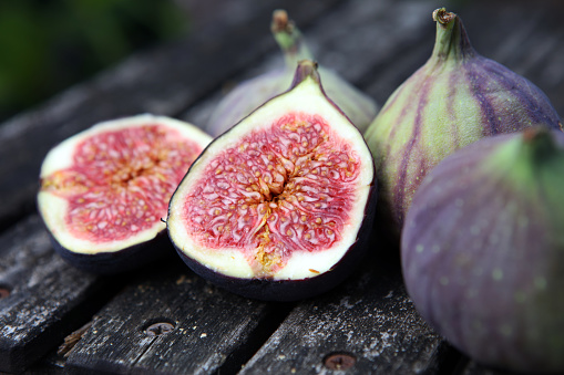 Fresh figs. Food Photo. whole and sliced figs fruits on rustic background