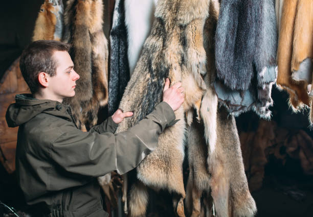 istock A young man hangs up the fur after treatment 1271008343