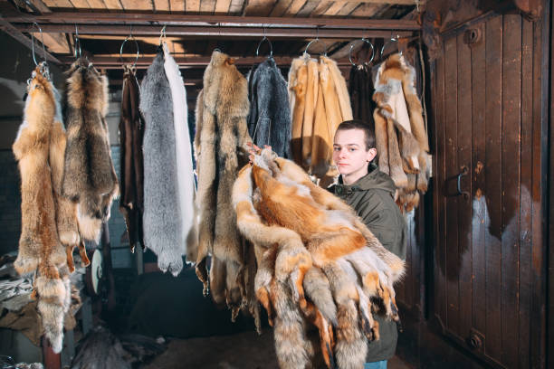 istock A young man hangs up the fur after treatment. 1271008940