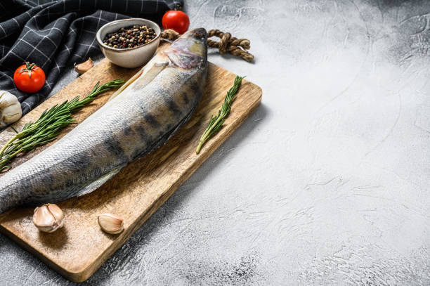 istock Raw pike perch, pikeperch fish. Fresh fish. White background. Top view. Copy space 1271010331