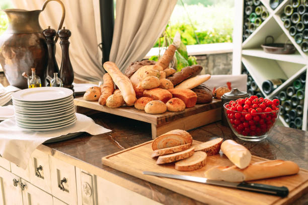 istock Variety of bread and cherry Tomatoes on the table. 1271011599