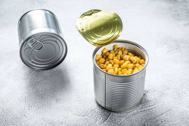 istock Canned corn in a tin can. canned food. White background. Top view 1271013987