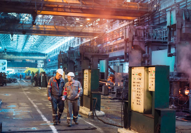 istock Workers in the steel mill. Metallurgical industry. 1271015987