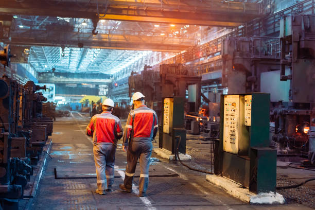 istock Workers in the steel mill. Metallurgical industry. 1271016007